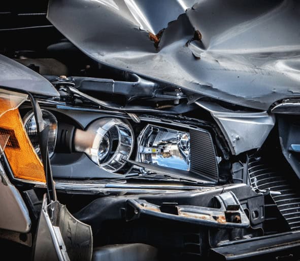 Damaged hood of car.
